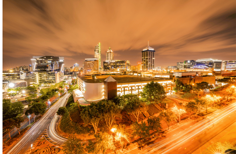 Join Our Top 10 Internship Opportunities for 2024! Young professionals outside Indwe Risk Services building in Johannesburg, eager to embark on their 2024 internship and learnership journey in the Short-Term insurance domain.