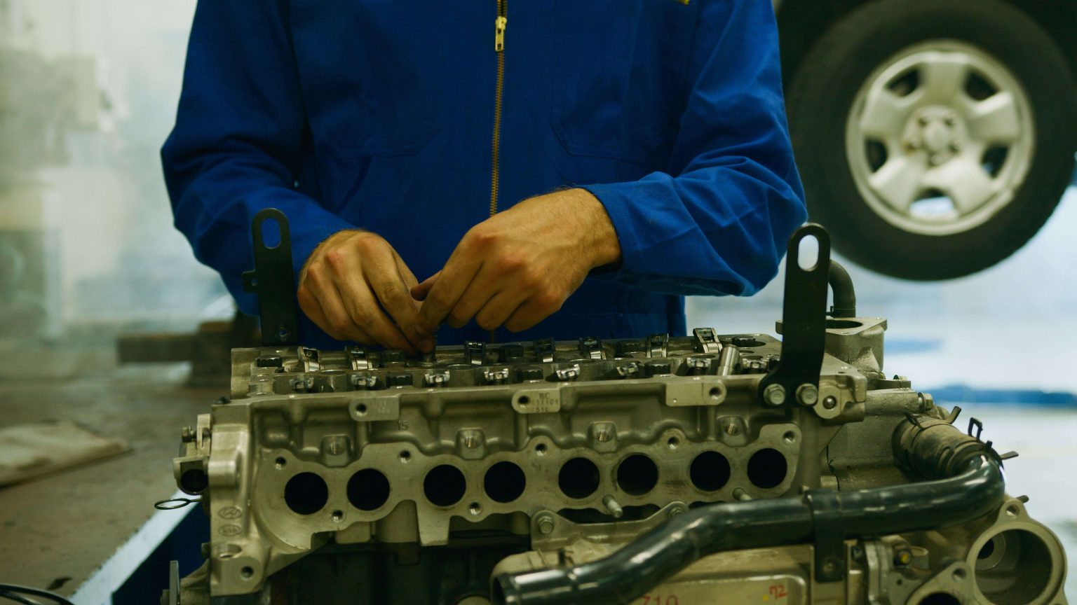 Junior Parts Marketer- VKB Group x1 Mechanic working on engine components.Junior Parts Marketer